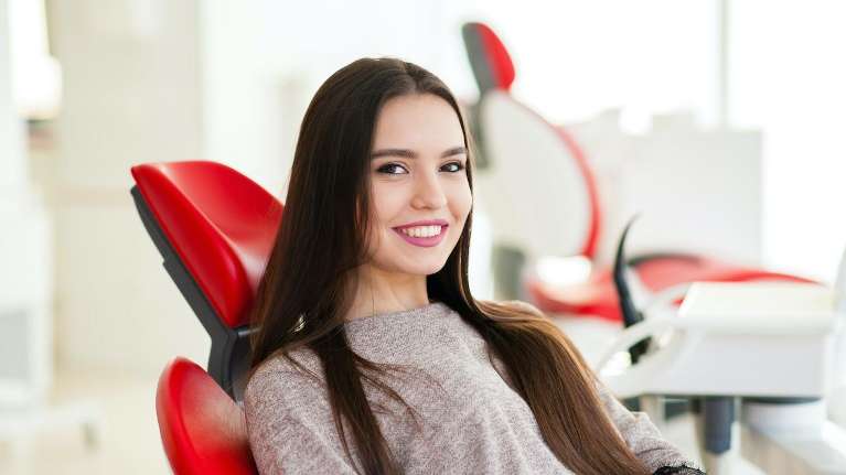 A smiling patient with Dental Crowns in Hermitage, PA