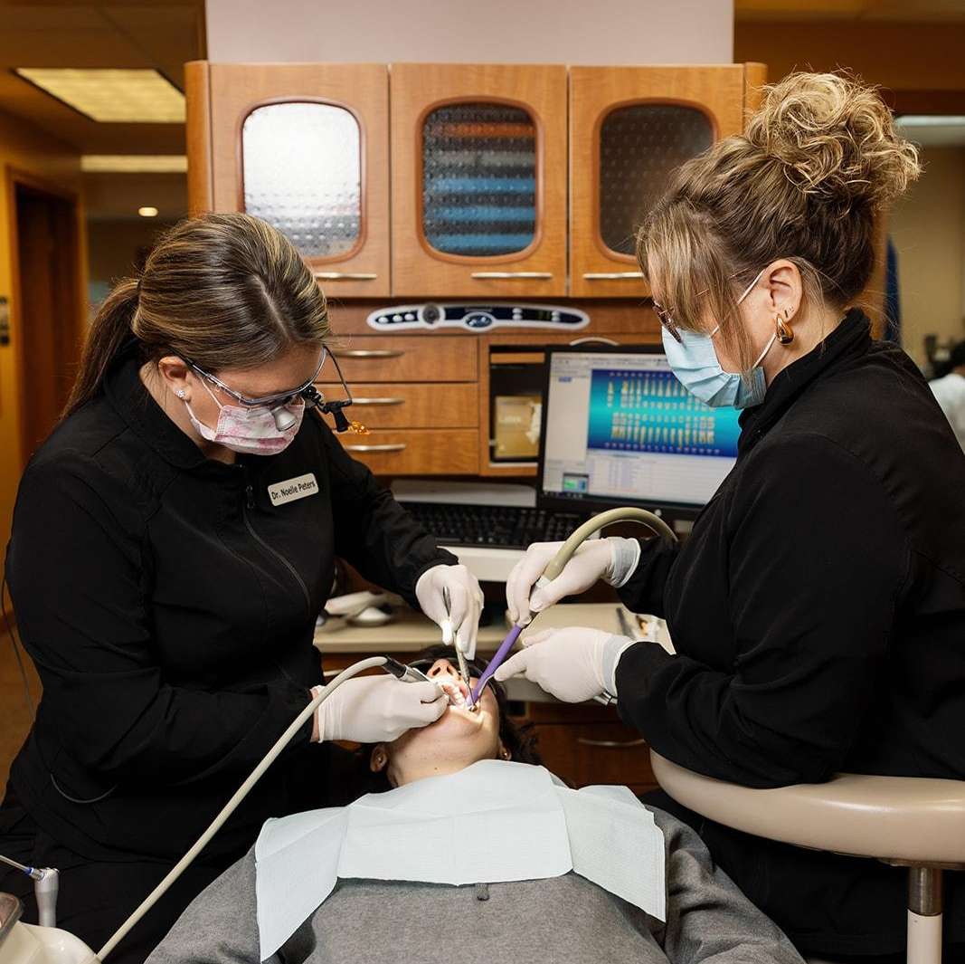 Dr Noelle Peters DMD fitting patient for ClearCorrect clear braces in 16148