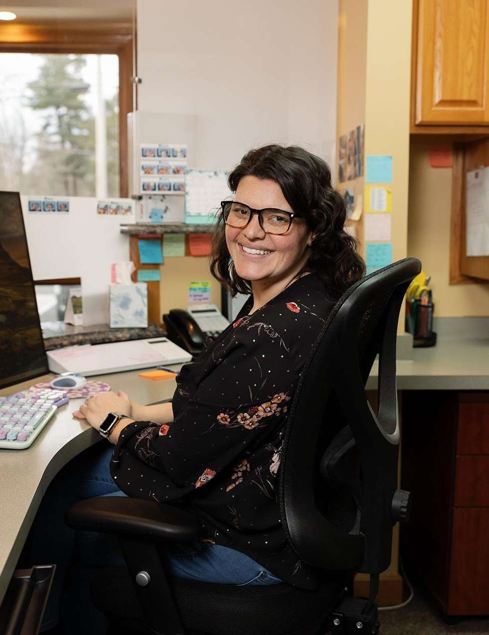 Receptionist at front desk of 16148 dentist office